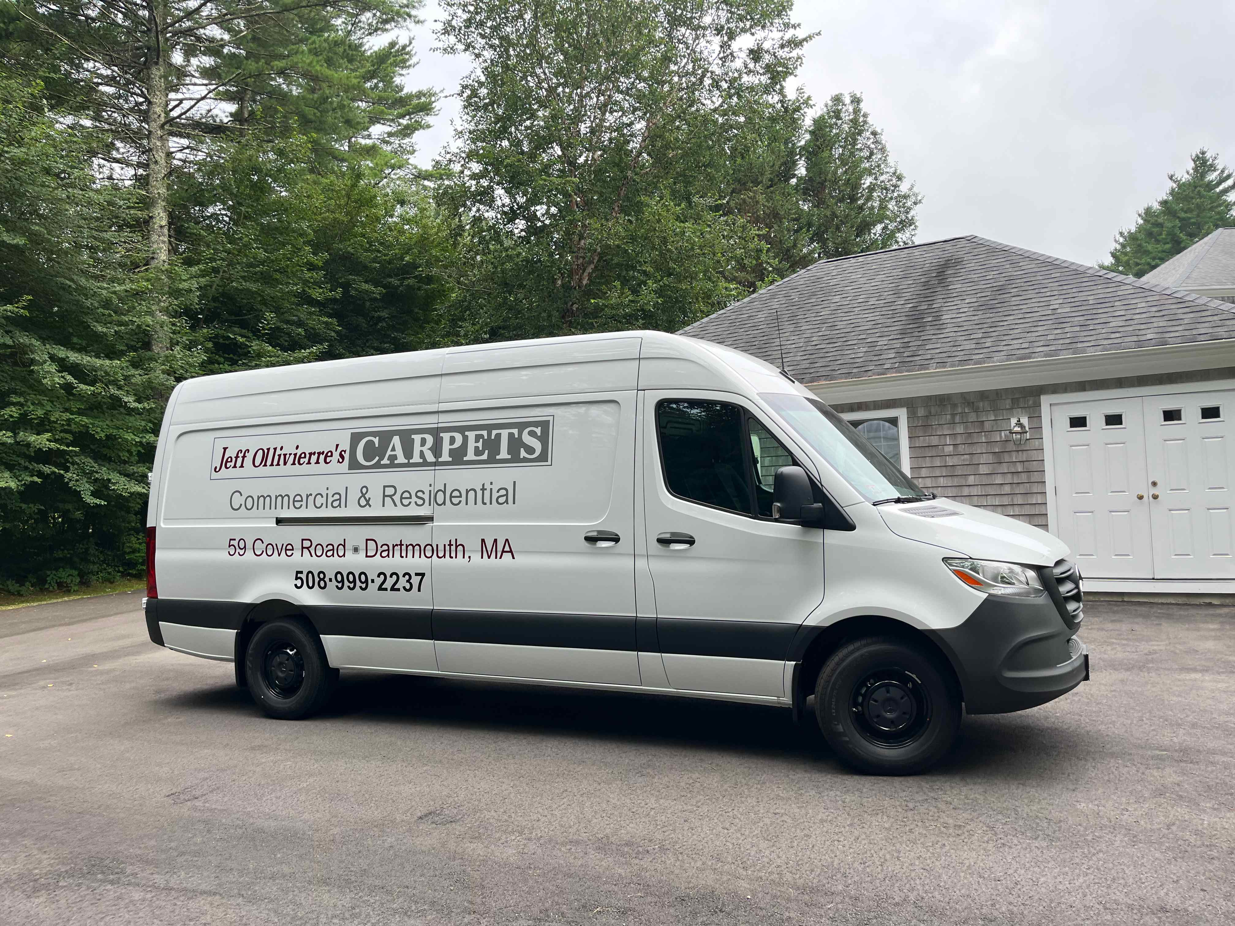 Jeff Ollivierre's Carpets commercial and residential service van