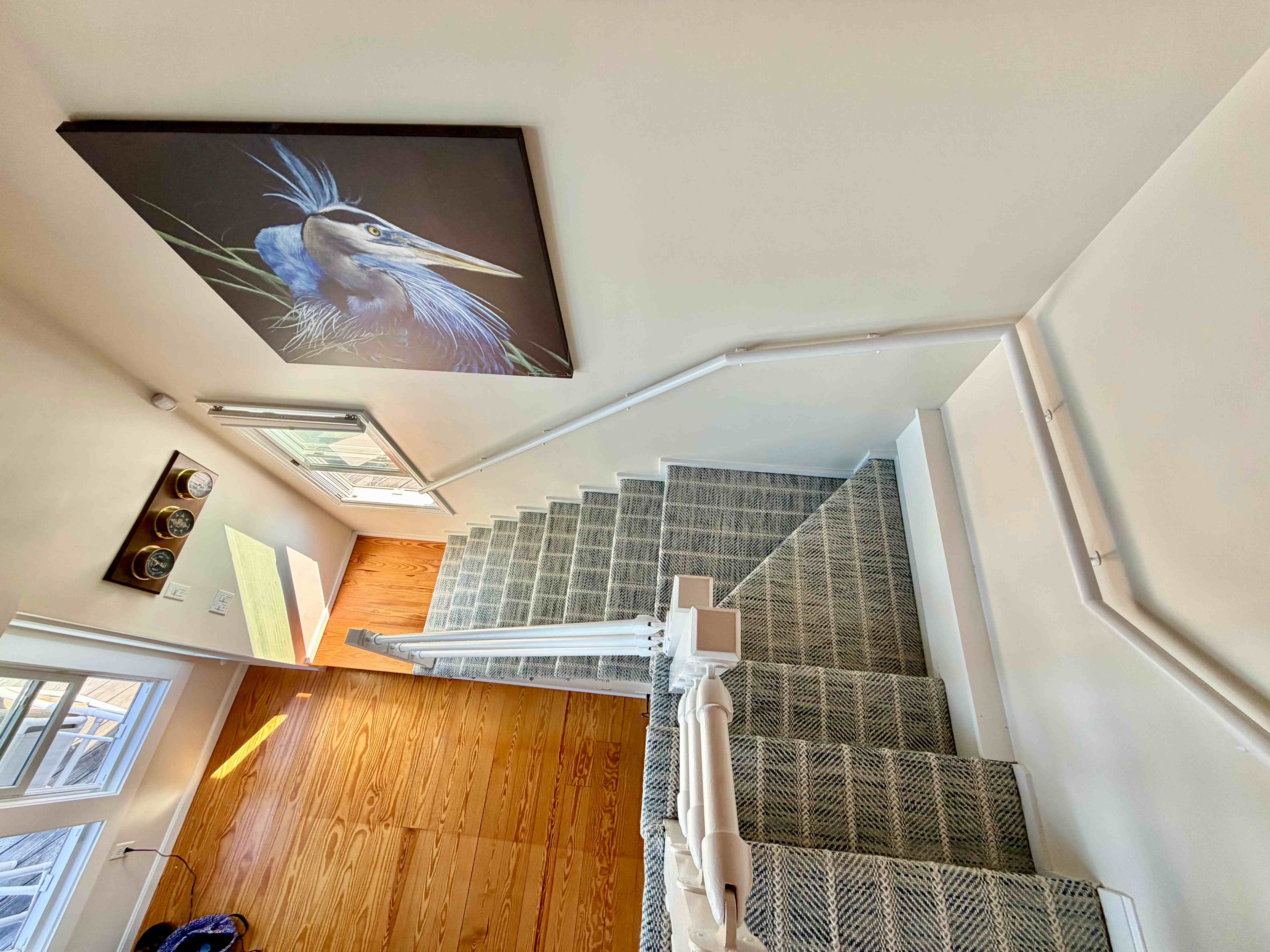 Gray plaid wool stair runner viewed from the top of the staircase