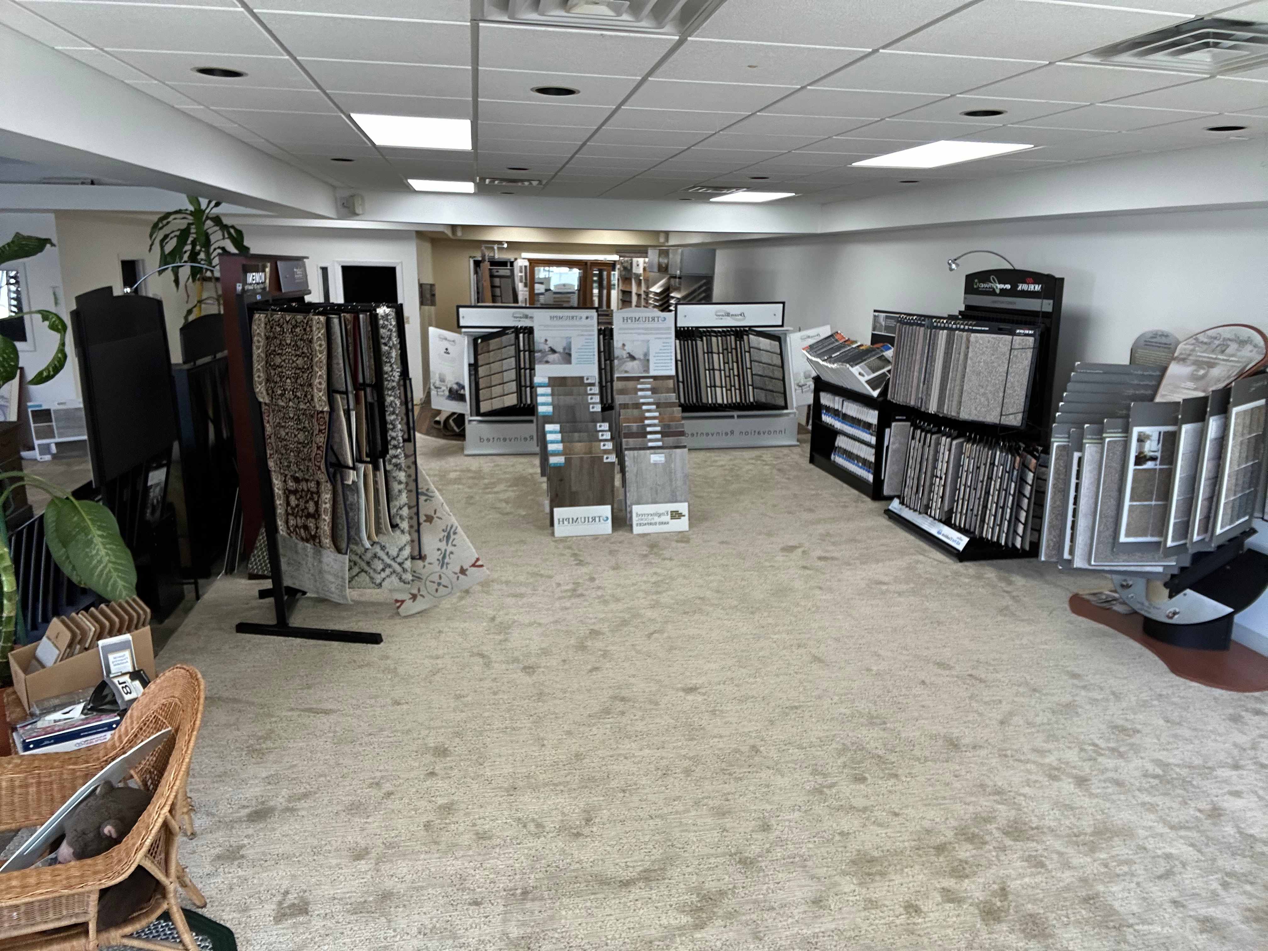 Interior of the flooring showroom with carpet, rug, and tile sample displays